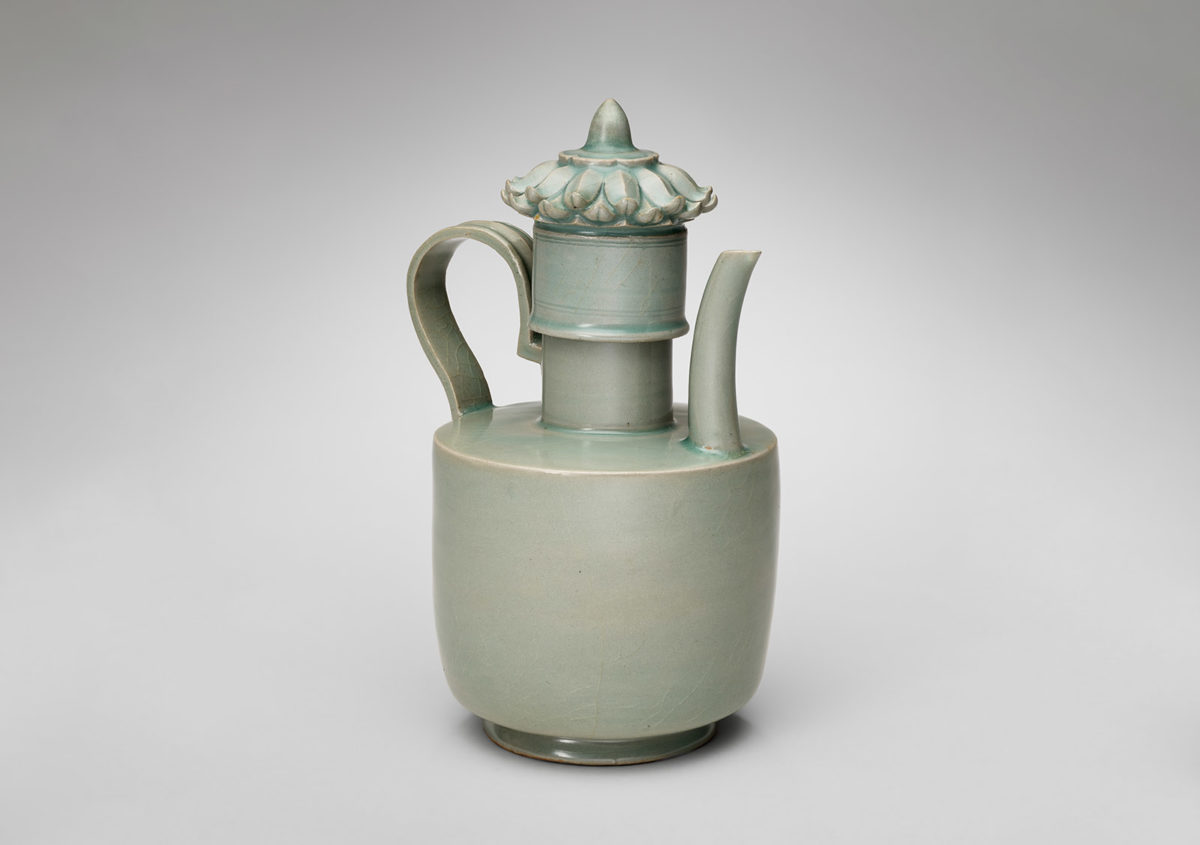 Side view of a blue-green ewer with lid.