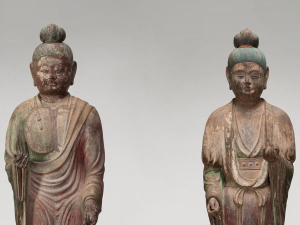 Two standing temple guardian statues